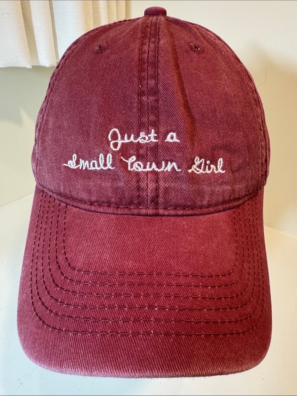 Altar’d State “Just a small town girl” burgundy cotton ball cap. OS.